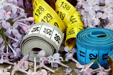 bunch of lilac flowers with measure tapeの写真素材