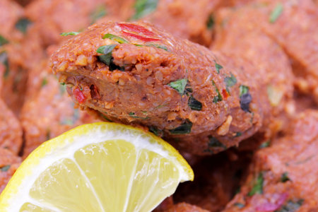 a slice of lemon and raw meatballs