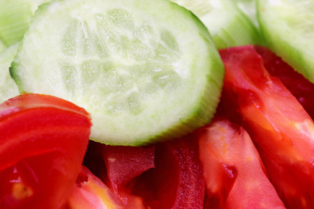 sliced tomato, pepper and cucumberの写真素材