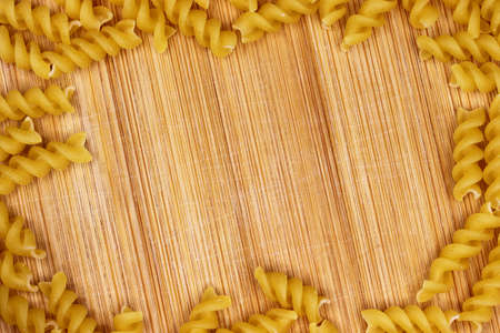 close-up uncooked cake on wooden backgroundの写真素材