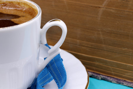 a cup of Turkish coffee and old bookの写真素材