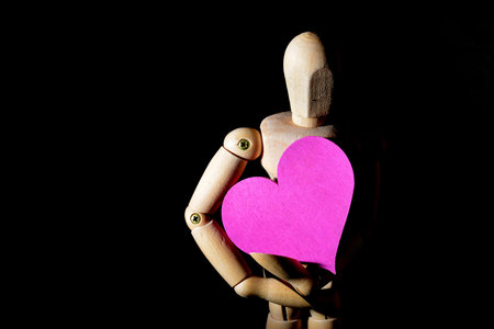 theme of love with heart and wooden mannequin