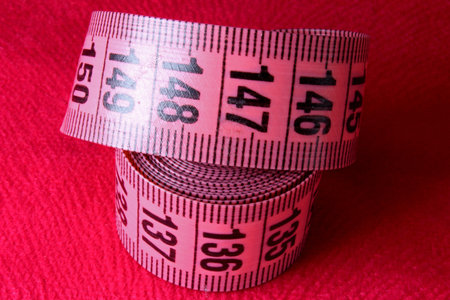 colored measuring tape on background