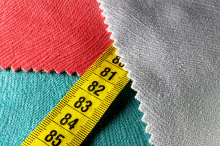 colored measuring tape on backgroundの写真素材