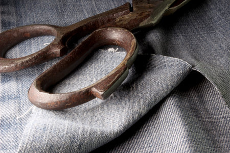 old scissors on fabric background