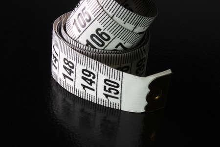 colored measuring tape on backgroundの写真素材