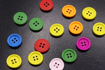 colored buttons on a black background