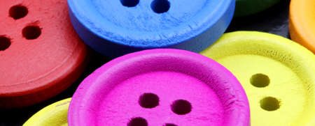 colored buttons on a black backgroundの写真素材