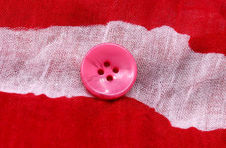 colorful buttons on fabric backgroundの写真素材