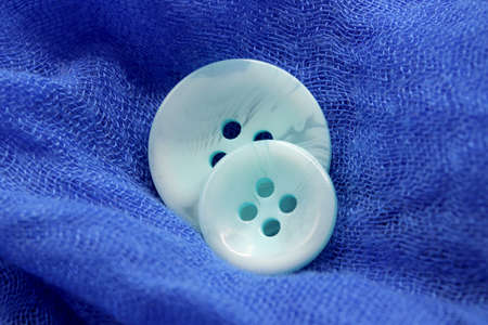 colorful buttons on fabric backgroundの写真素材