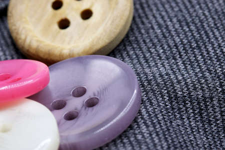colorful buttons on fabric backgroundの写真素材