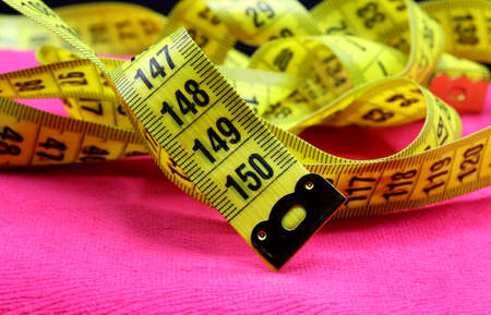 tailoring supplies and sewing accessories on fabric backgroundの写真素材