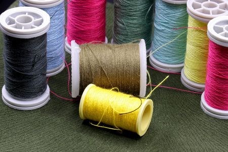 tailoring supplies and sewing accessories on fabric background