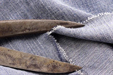 tailoring supplies and sewing accessories on fabric background