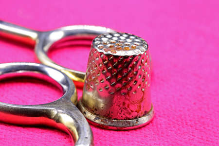 tailoring supplies and sewing accessories on fabric backgroundの写真素材