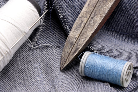 tailoring supplies and sewing accessories on fabric background