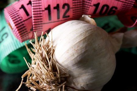 measuring tape and dry garlicの写真素材