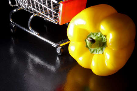 shopping cart and bell pepperの写真素材