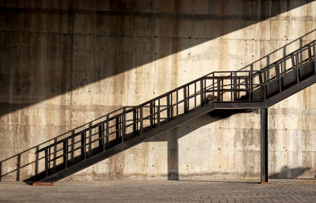 old iron stairs on a buildingの写真素材