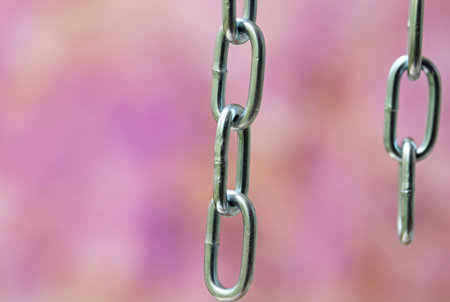 iron chain with link on a colorful backgroundの写真素材