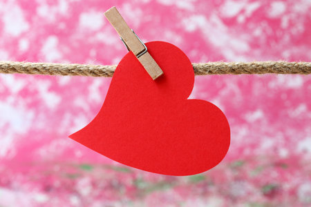red paper hearts hanging on clothesline