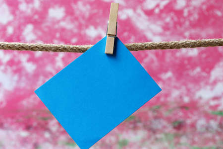 note paper hanging on clotheslineの写真素材
