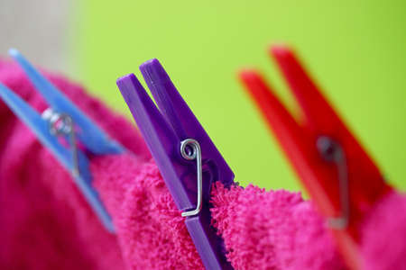 red towel hanging on a clotheslineの写真素材