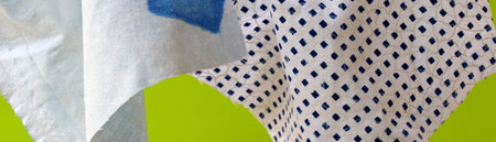 pieces of colorful fabric on a green background
