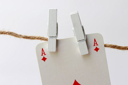 playing cards hanging on clotheslineの写真素材