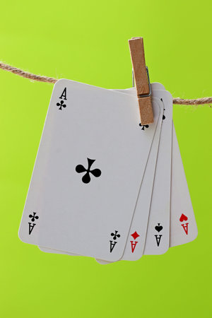 playing cards hanging on clothesline