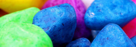 close-up colorful painted pebbles backgroundの写真素材