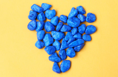 blue pebbles on yellow background