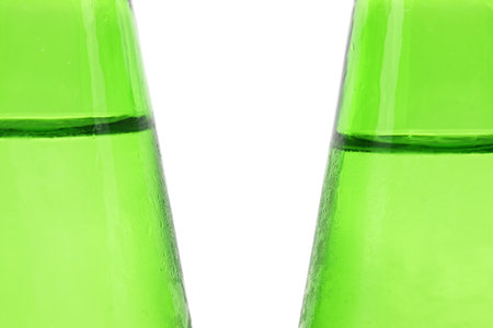 detail of close-up green soda bottle isolated on white backgroundの写真素材