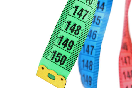 close-up colorful measure tapes isolated on a white background