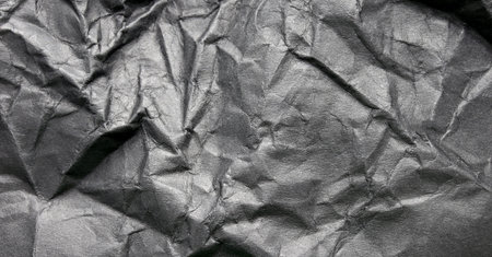 crumpled black paper texture background