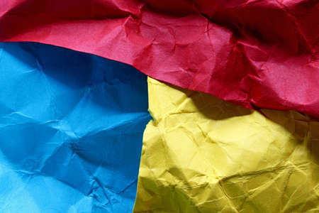 crumpled colorful paper texture backgroundの写真素材
