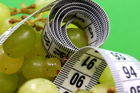 close-up green grape with white measuring tape