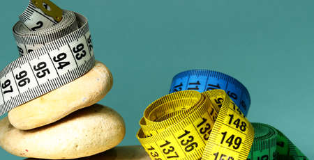 diet concept with measuring tape and natural stonesの写真素材