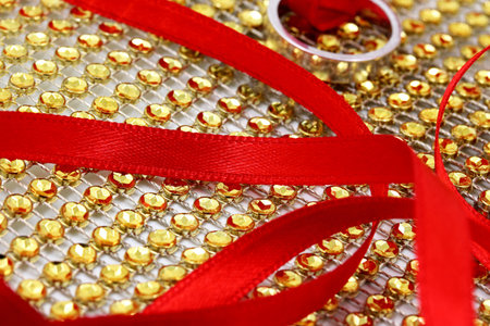 wedding concept with red wedding ring ribbon