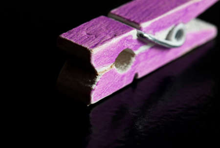 close-up of a pink clothespin on a black backgroundの写真素材