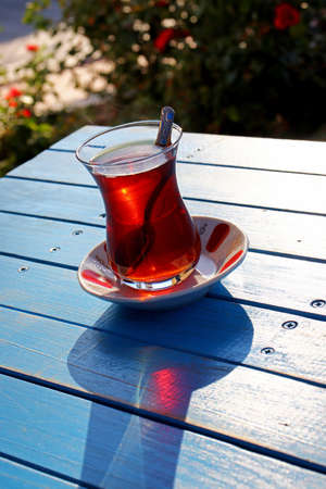 glass of Turkish tea on wooden tableの写真素材