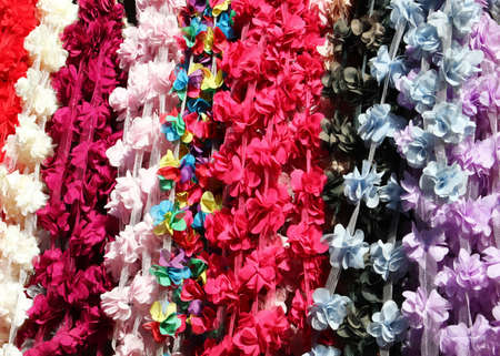 close-up colorful artificial flowers backgroundの写真素材
