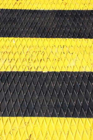 background with yellow and black warning stripesの写真素材