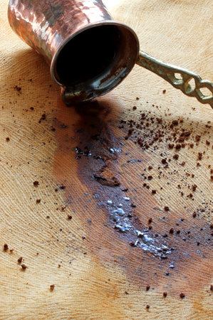 Turkish coffee poured from the coffee pot to the tableの写真素材