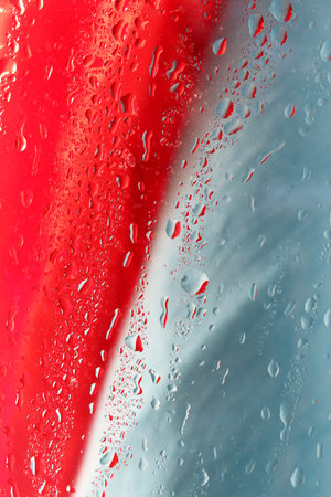 water drops on glass colorful backgroundの写真素材