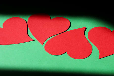 red hearts on a green backgroundの写真素材