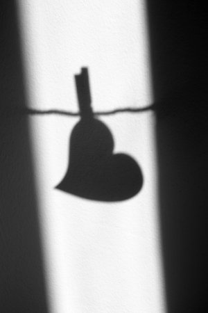 silhouette of a heart on gray backgroundの写真素材