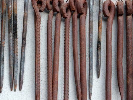 old rusty blacksmith tools on the wall