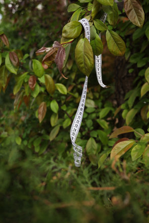 diet concept with measure tape in the garden