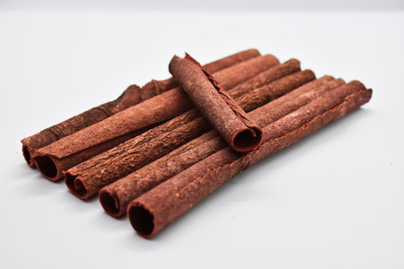 Fragrant cinnamon sticks isolated on white background